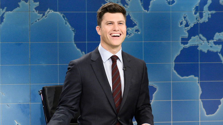 Colin Jost smiles and anchors