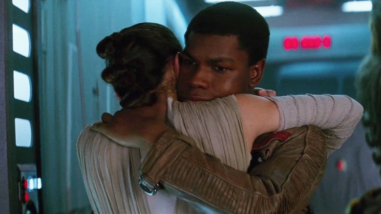 Finn hugging Rey