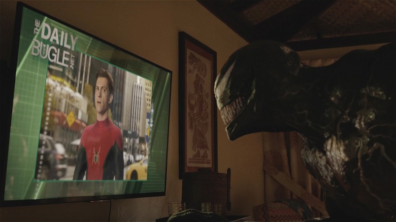Venom staring at Spider-Man tv