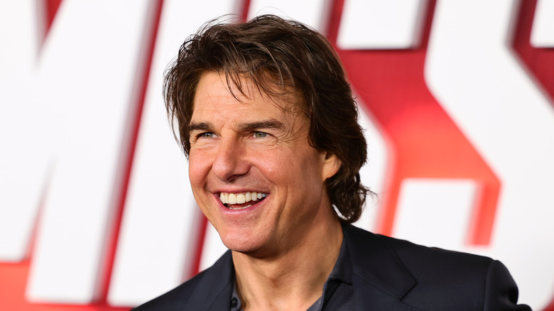 Tom Cruise smiling black jacket