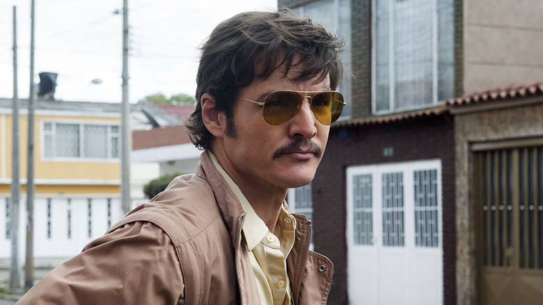 Javier Peña in yellow aviator sunglasses