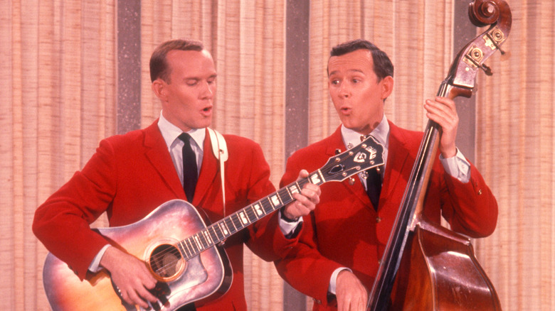 Smothers Brothers singing and playing instruments